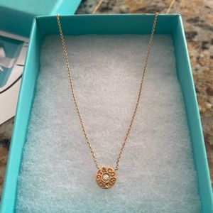 Tiffany & Co 1837 Circle Pendant 18k Rose Gold with round brilliant diamond.